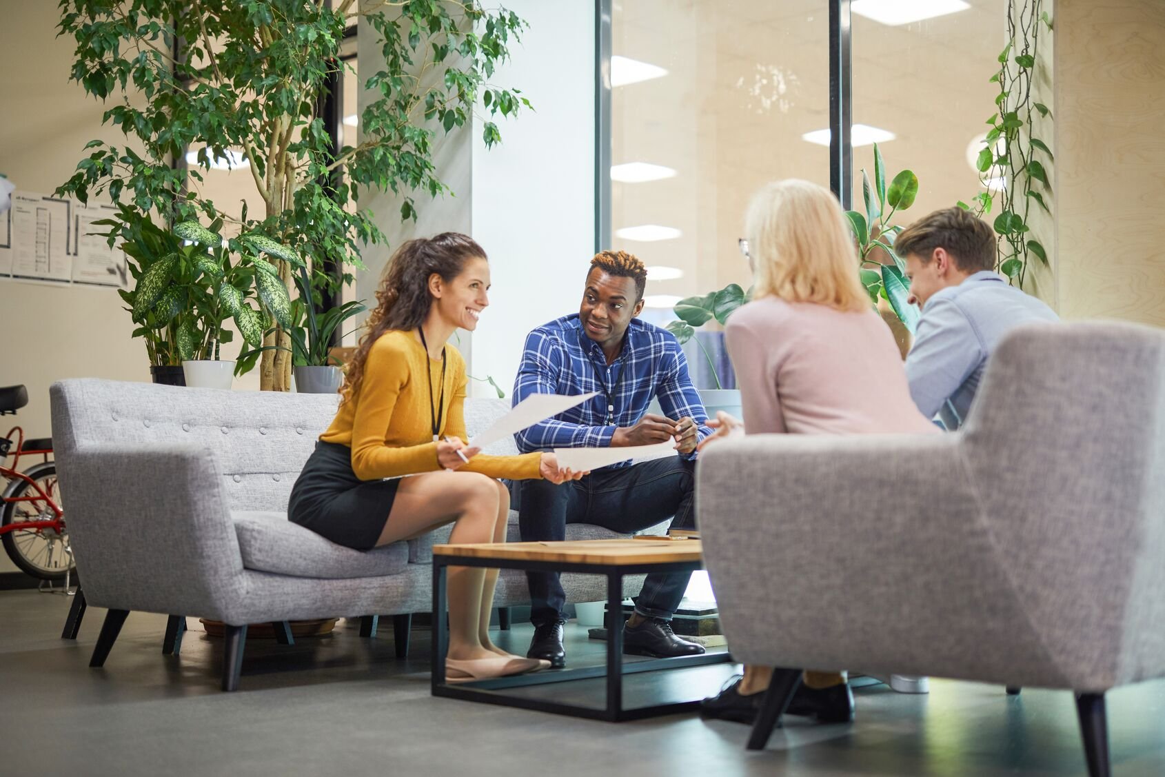 Web_Wide-Creative team discussing sales statistics in office